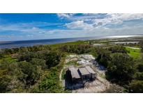 Aerial view of house under construction by the lake at 71 E Lake Shore Blvd, Kissimmee, FL 34744