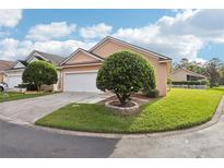 Well-maintained house with a spacious yard and driveway at 1501 Fox Glen Dr, Winter Springs, FL 32708