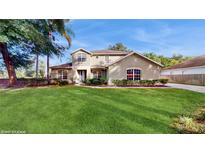 Two-story house with green lawn and mature trees at 201 Capri Cove Pl, Sanford, FL 32771