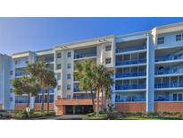 Three-story building with balconies and parking in front at 5300 S Atlantic Ave # 2-502, New Smyrna Beach, FL 32169