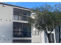 Two-story building with balconies and screened-in patios at 2030 Cascades Blvd # 302, Kissimmee, FL 34741