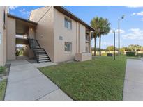 Two-story building with stairs and walkway at 5208 Via Hacienda Cir # 201, Orlando, FL 32839