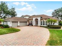 Beautiful home with three-car garage and paver driveway at 1869 Merlot Dr, Sanford, FL 32771