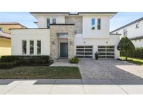 Modern two-story house with stone accents at 1429 Chapman Cir, Winter Park, FL 32789