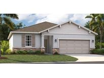 One-story house with gray siding and two-car garage at 811 Pebble Crest Ln, Eagle Lake, FL 33839