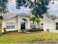 Single-Gathering home with a well-manicured lawn at 218 Meadow Green Dr, Davenport, FL 33837