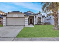 One-story house with attached garage and well-maintained lawn at 620 Birgham Pl, Lake Mary, FL 32746