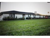 Ranch style home with brick exterior and large yard at 3555 E Johnson Ave, Haines City, FL 33844