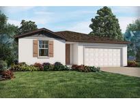 One-story home with two-car garage, landscaping and light brown accents at 3154 Viceroy Ct, Poinciana, FL 34759