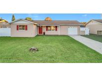 Charming single-story house with a well-manicured lawn and attached garage at 8244 Cyers Ln, Orlando, FL 32822