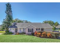 Single-story home with a well-manicured lawn and landscaping at 1084 Villa Ln # 72, Apopka, FL 32712