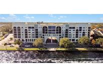 Aerial view of a waterfront building with parking and city views at 225 W Seminole Blvd # 206, Sanford, FL 32771