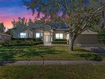 Beautiful one-story home with a landscaped lawn and a charming facade at 3954 Old Dunn Rd, Apopka, FL 32712