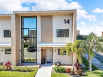 Modern two-story home with sleek design and landscaped grounds at 7598 Brooklyn Dr, Kissimmee, FL 34747