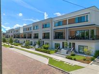 Modern townhouses with clean lines and attractive landscaping at 42 W Harding St # F, Orlando, FL 32806