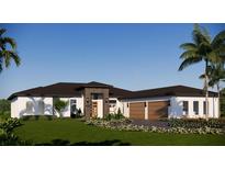 Single-story home with modern design, two-car garage, and landscaped yard at 17144 Phil C Peters Rd, Winter Garden, FL 34787