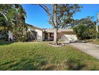 Ranch-style home with mature landscaping and driveway at 1621 Puritan,, Winter Park, FL 32792