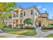 Two-story townhome with inviting front porch and landscaped lawn at 1812 Arbor Lakes Cir # 1812, Sanford, FL 32771