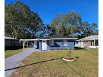 Newly renovated blue house with a landscaped front yard at 1503 33Rd Nw St, Winter Haven, FL 33881
