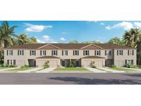 Three-unit townhome building with attached garages and landscaping at 3307 Private Oak Dr, Apopka, FL 32703