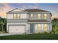 Two-story house with gray siding, white garage door, and landscaping at 6018 Forest Perch Dr, St Cloud, FL 34771