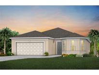 Single-story home with a two-car garage and attractive landscaping at 6024 Blue View Way, Saint Cloud, FL 34771