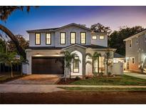 Stunning two-story home with brick facade and palm trees at 812 Montana St, Orlando, FL 32803