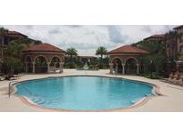 Resort-style pool with 2 gazebos and lounge chairs at 5548 Metrowest Blvd # 310, Orlando, FL 32811