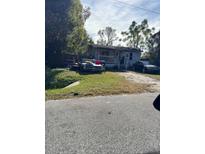 Ranch-style home with carport and yard at 1530 Van Ness St, Orlando, FL 32810