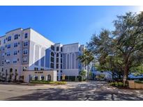 Upscale building exterior, featuring a grand entrance and landscaping at 304 E South St # 5022, Orlando, FL 32801