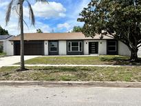 Newly renovated single-story home with modern facade and landscaping at 7023 Talbot Dr, Orlando, FL 32819