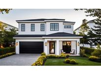 Stunning two-story home with a modern design and landscaped front yard at 227 Page St, Orlando, FL 32806