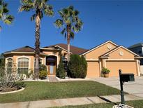 Attractive single-Gathering home with a large driveway and landscaped yard at 9111 Woodbridge Oak Ter, Orlando, FL 32825