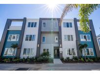 Modern building exterior with blue and white accents at 7740 Sandy Ridge Dr # 9-236, Kissimmee, FL 34747