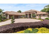 Grand two-story home with tile roof and landscaped yard at 2009 Castelli Blvd, Mount Dora, FL 32757