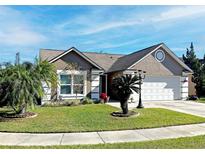 Attractive one-story home with landscaped lawn and driveway at 553 Whittingham Pl, Lake Mary, FL 32746