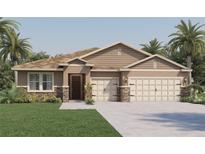 One-story home with stone accents and a two-car garage at 1676 Three Bars Rd, Kissimmee, FL 34744