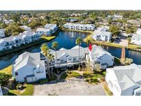 Aerial view of waterfront property showing building location and surrounding community at 2516 Woodgate Blvd # 206, Orlando, FL 32822