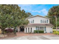 Two-story house with brick facade, landscaping, and a brick driveway at 2351 Westwood Dr, Longwood, FL 32779