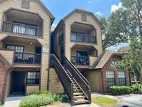 Two-story condo building with stairs and balconies at 315 Lakepointe Dr # 302, Altamonte Springs, FL 32701