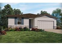 Charming single-story home with a landscaped front yard and attached garage at 1328 Oak Valley Dr, Auburndale, FL 33823