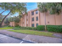 Condo building with landscaping and convenient parking at 620 Cranes Way # 207, Altamonte Springs, FL 32701