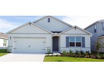 Curb appeal abounds in this charming one-story home featuring a two-car garage at 1296 Hanoverian Dr, Lake Alfred, FL 33850