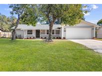 Newly renovated house with a large yard and attached garage at 5851 Edouard St, Oviedo, FL 32765
