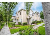 Attractive townhome with landscaped yard and walkway at 2901 Edenshire Way # 104, Kissimmee, FL 34746