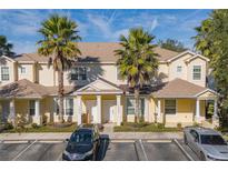 Front view of charming townhome with two parking spaces at 17417 Placidity Ave, Clermont, FL 34714