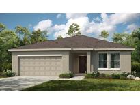 One-story home with a two-car garage and landscaped front yard at 4410 Petunia St, Lake Hamilton, FL 33851