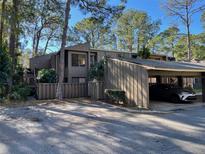 Two-story condo building with carport and private fenced yard at 5308 Pebble Beach Dr # F-01-1, Orlando, FL 32811
