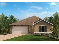 Charming single-story home with a stone and stucco facade, landscaped yard, and attached garage at 159 Cypress Knees Dr, Lake Wales, FL 33859