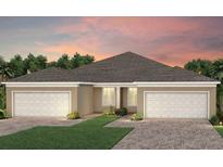 Two-story home with two-car garage and attractive landscaping at 2326 Daisy Tree Rd, St Cloud, FL 34771